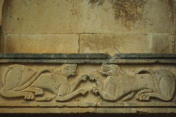 Serramonacesca - Abruzzo - Abbey of San Liberatore in Maiella - Detail of the architrave with two feline animals that collide - obrazy, fototapety, plakaty