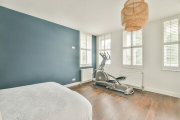 Bedroom with elliptical exercise machine