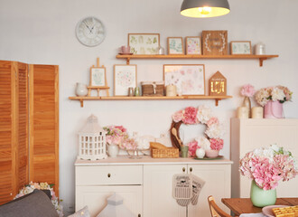 Pink kitchen. Studio apartment. Loft interior. Shelves and spring decor in room. Rent and delivery of housing. Hostel and hotel. Valentine's day, mother's day