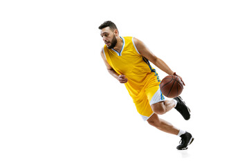 Fototapeta na wymiar Full length portrait of professional basketball player training isolated on white studio background. Sport, motion, activity, movement concepts.