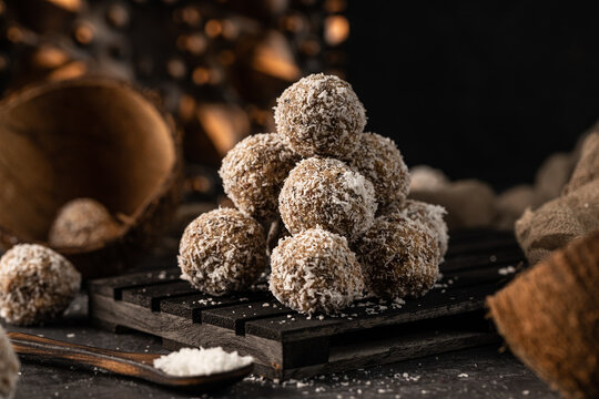 still life photo of healthy, homemade, delicious sweets. Tasty lactose and sugar free coconut balls with healthy ingredients