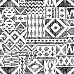 Black and white seamless geometric pattern. Ethnic and tribal motifs. Ornament in patchwork style. Handmade with pencil on paper. Grunge texture. Vector illustration. - 483136362