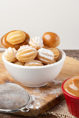 Delicious mini churros stuffed with dulce de leche.