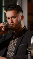 elegant man with glass of whiskey
