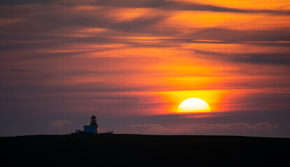 Fototapeta na wymiar Brough of Birsay Lighthouse at Sunset, Island of Orkney, Scotland 