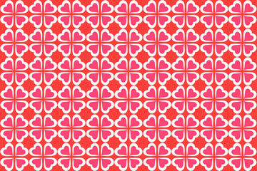 オレンジ地に白とピンクのハートの四つ葉のクローバー模様