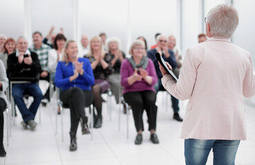 Fototapeta premium Businesswoman addressing colleagues at office meeting