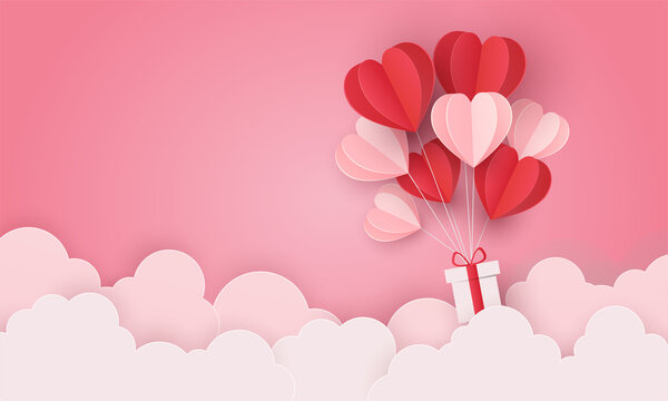 love heart balloon and gift flying over cloud. valentine's day, greeting card, posters and wallpaper. isolated on pink background. vector illustration paper art craft style. copy space for text input.