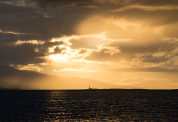 Dramatic Cloud Scape during Sunset - Oban Harbour, Argyll, Oban, Scotland - Moody silhouette image of sunset looking towards Lismore Lighthouse.