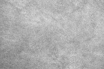 Light grey suede texture backdrop. Grey color leather skin natural pattern or abstract background.