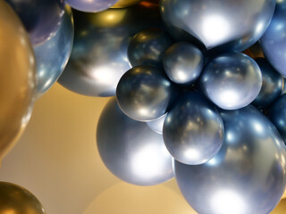 Fototapeta premium Balloons of gold and blue colors