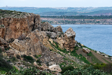 Fototapeta na wymiar Weathered rock formation at the mountains and cliffs of the coast of Selmun, Malta