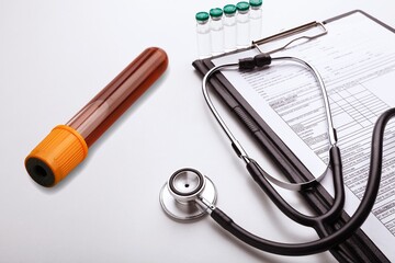 Blood tube for test detection of virus Covid-19 Omicron Variant on papers document.