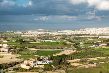 Fototapeta na wymiar Mdina, Malta - 01 07 2022: View over Mosta and agricultural surroundings, taken from the Mdina fortress