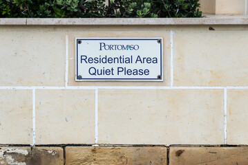 Saint Julian, Malta - 01 07 2022: Sign 'Quiet please' for the calm of the private residential area of Portomaso