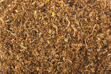 A scattering of cut tobacco as a background.