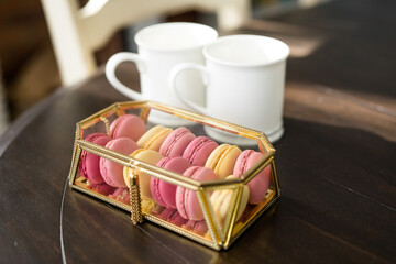 Pink French Macarons in Gold and Glass Box, Valentine's Day Dessert, Fancy Dessert, White Coffee Cups, Copy Space