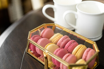 Pink French Macarons in Gold and Glass Box, Valentine's Day Dessert, Fancy Dessert, White Coffee Cups, Copy Space