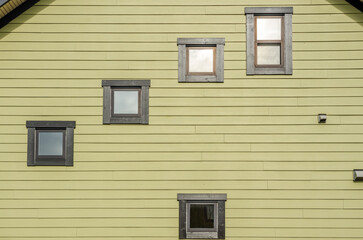 The top of the house or apartment building with nice window.