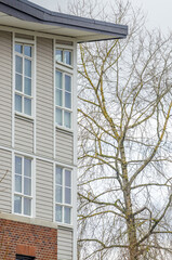 The top of the house or apartment building with nice window.