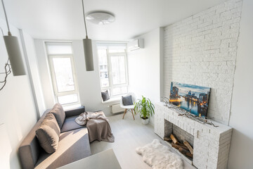 Fototapeta na wymiar Contemporary studio apartment with kitchen open to living room.