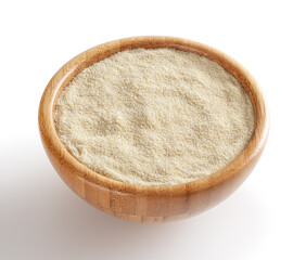 Semolina flour in wooden bowl isolated on white background with clipping path