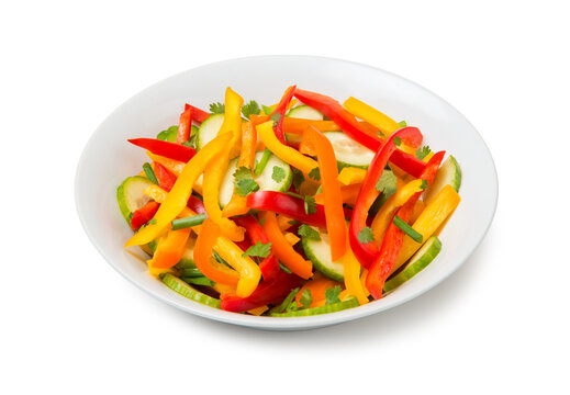 Salad of bell pepper, cucumber and green onions isolated on white background.