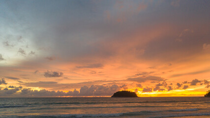 .aerial view stunning sunset above Pu island Kata beac Phuket Thailand. .Scene of colorful red light trough in the dark blue sky..Gradient color. Sky texture, abstract nature background.