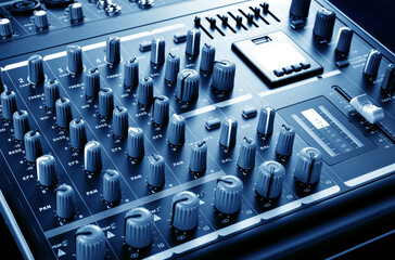 analog mixing console on blue