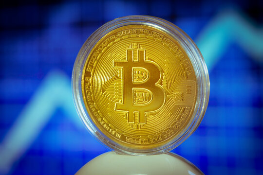 Symbolic bitcoin coin on stock market chart background. Cryptocurrency, stock market, blockchain, digital money concept.