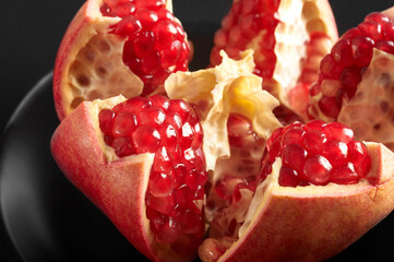 pomegranate grains close-up on a black background