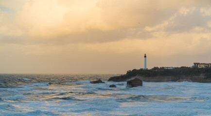 Panoramic view of Biarritz's beach and a lighthouse.