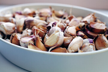 Garlic cloves closed up. White background.