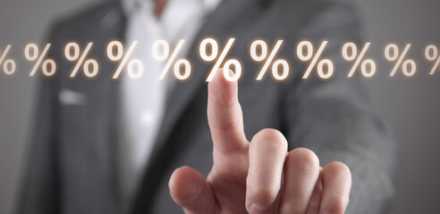 Male hand touching percent icons.