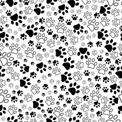 Black and white paw prints seamless fabric textile design pattern