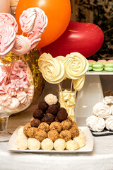 Catering in a restaurant. Cake, dessert, cupcakes, sweets, trifles, macaroons. Fresh berries (strawberries, blueberries). A table for a wedding, a children's party, a birthday.