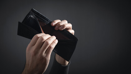 Man showing empty wallet. Bankruptcy