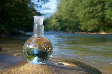 Flask with clear river water.