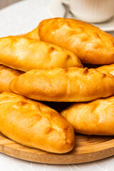 Lots of pies and buns. Hot cakes. Breakfast concept. Breakfast with buns.