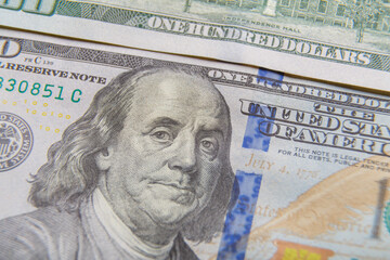 Obraz na płótnie Canvas Fragments of dollar bills, very close-up. Horizontal