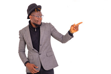 young business man pointing finger aside smiling.