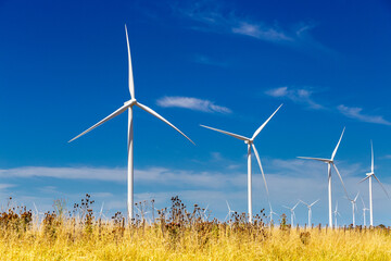 Wind energy turbine. Wind power electricity generator. Climate change and environmental protection.