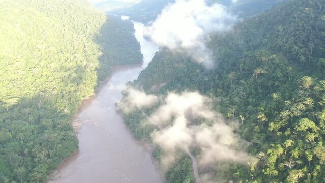 Drone flight through Tarapoto amazon forest with clouds in the morning hours 