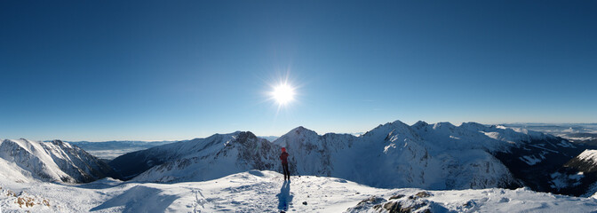 Winter mountain landscape / Climber on the top / Trekking winter