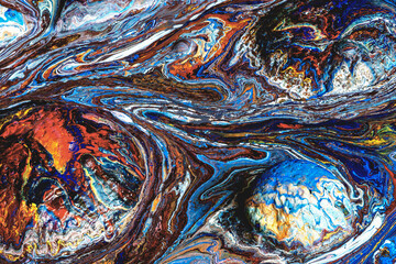 Abstract background of cosmic worlds filled with acrylic paint. Close-up. 