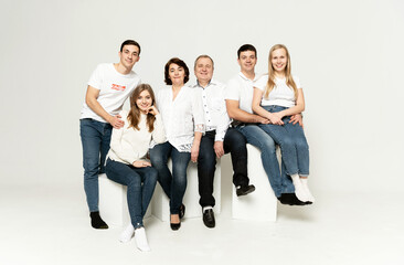 cheerful family on a white background. people of different ages and nationalities. family members. group portrait on white background