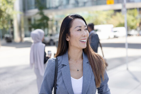 Portrait Of Asian Business Executive On City Street