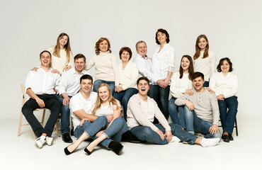 cheerful family on a white background. people of different ages and nationalities. family members. group portrait on white background