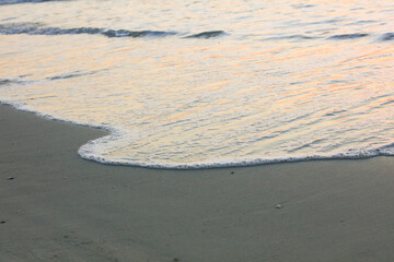 Beautiful Sea wave or white soft seawave surfs on white sand beach on island ,beautiful beach background
