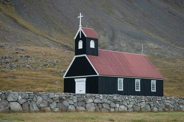 a wooden church with a red roof in Iceland
